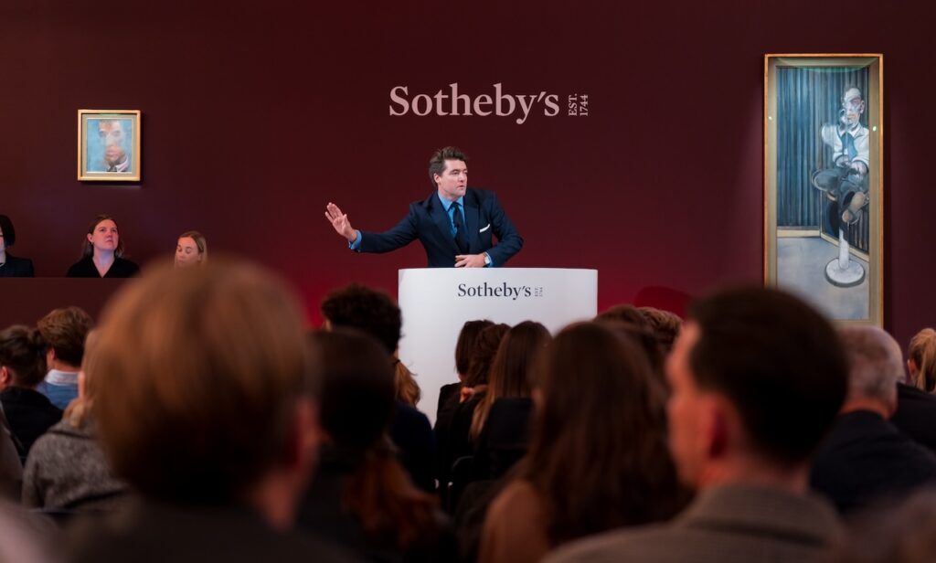 Auctioneer Tom Eddison in action at Sotheby’s Contemporary Evening Sale, October 2025. Courtesy: Sotheby’s. © Rayan Bamhayan